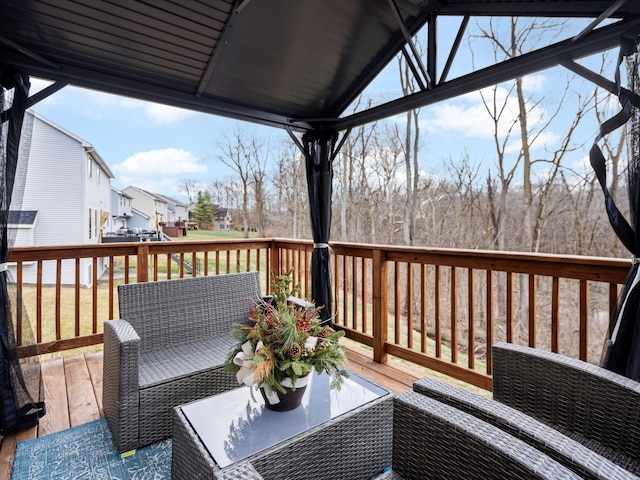 wooden deck featuring an outdoor hangout area