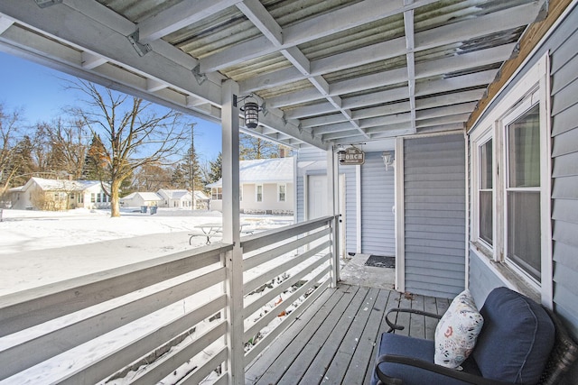 view of snow covered deck