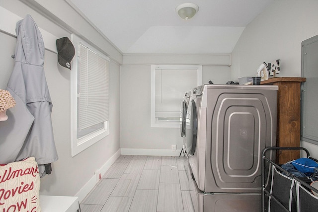 clothes washing area with separate washer and dryer