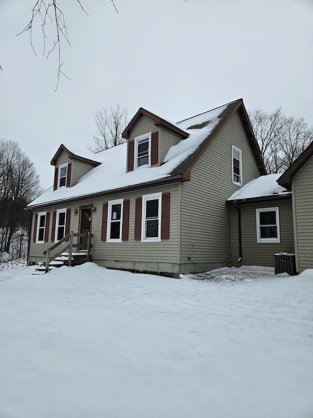 new england style home featuring central AC