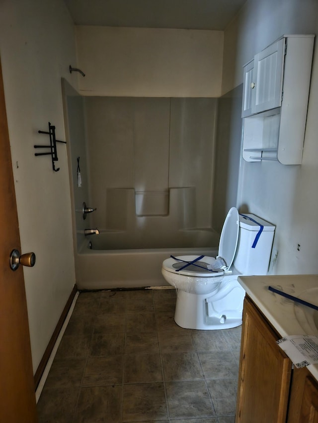 full bathroom featuring vanity, bathtub / shower combination, and toilet