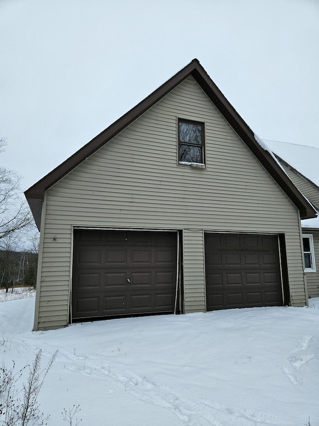 view of snow covered garage