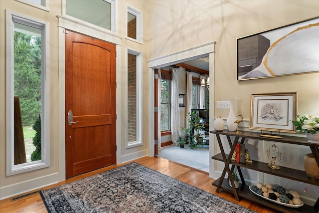 foyer with light hardwood / wood-style floors