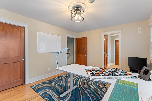 bedroom featuring a closet and light hardwood / wood-style flooring