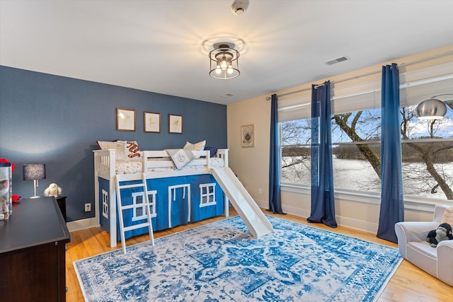 bedroom with hardwood / wood-style floors