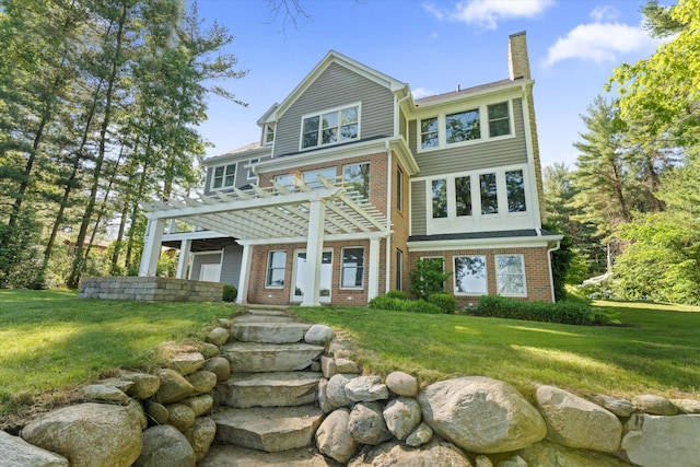 view of front of property with a pergola and a front yard