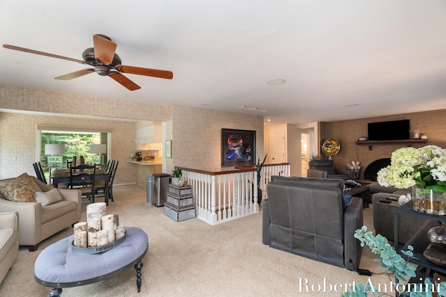 living room with ceiling fan and light carpet