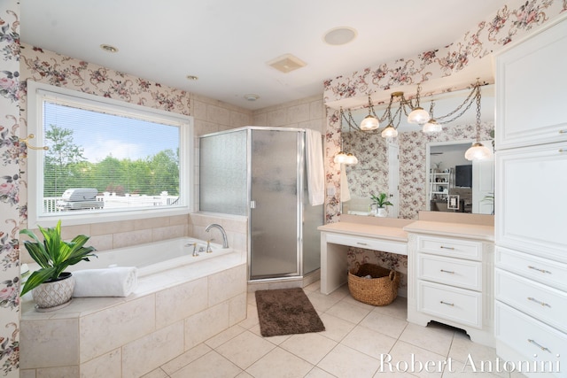 bathroom featuring tile patterned flooring, separate shower and tub, and vanity