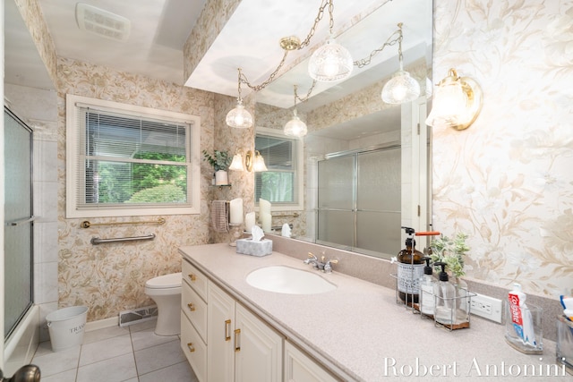 bathroom with tile patterned floors, vanity, and toilet