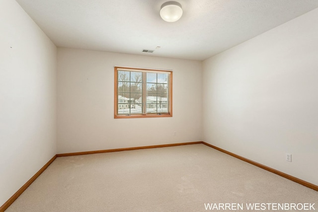 view of carpeted spare room