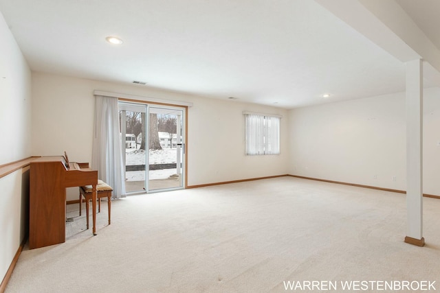 empty room featuring light colored carpet