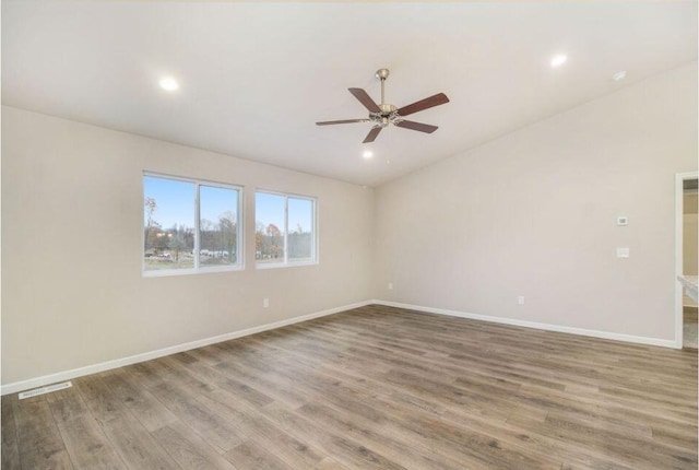 unfurnished room featuring hardwood / wood-style flooring and ceiling fan