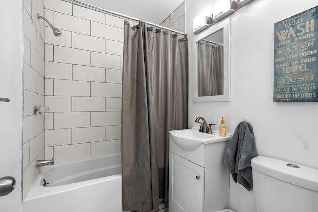 full bathroom featuring vanity, shower / bath combination with curtain, and toilet