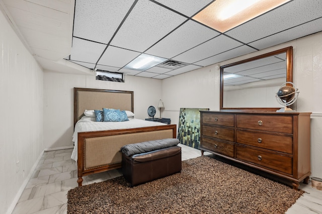 bedroom featuring a drop ceiling