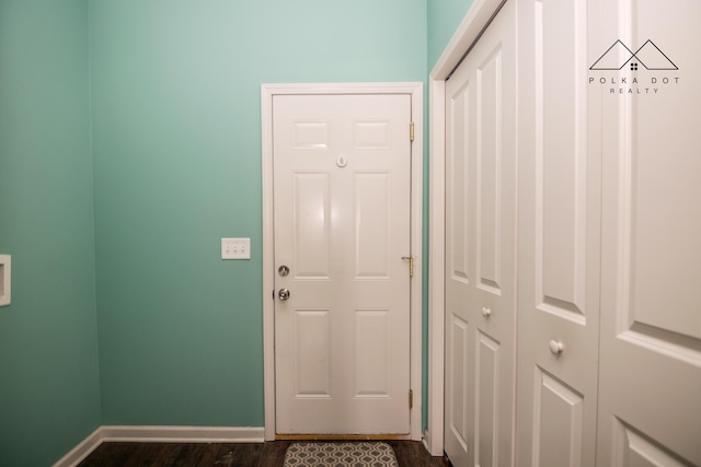 doorway to outside featuring dark wood-type flooring