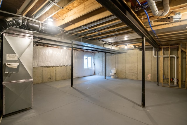 basement featuring heating unit