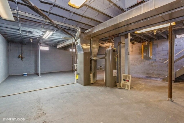 basement with electric panel, gas water heater, and heating unit