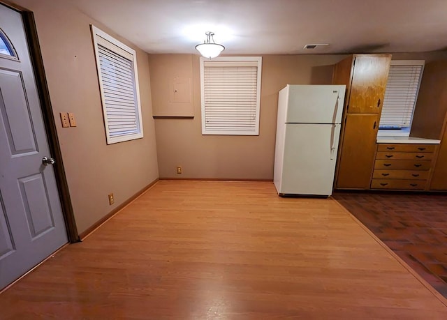 kitchen featuring white fridge and light wood-type flooring