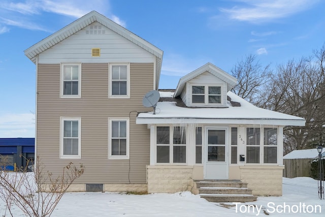 view of front of property with a sunroom