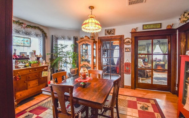 dining space with light wood-type flooring