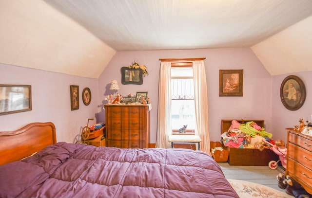 bedroom featuring lofted ceiling