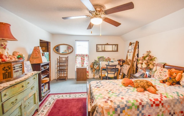 bedroom with ceiling fan and vaulted ceiling