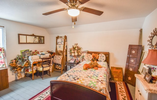 bedroom featuring ceiling fan and vaulted ceiling