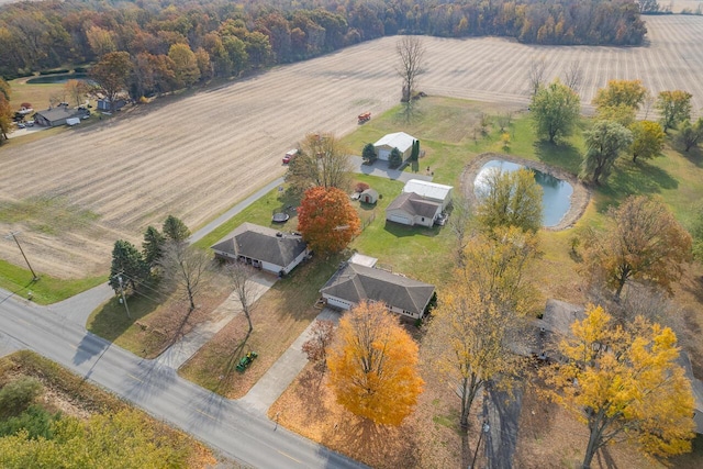 drone / aerial view with a water view and a rural view