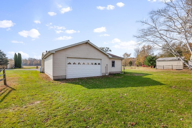 garage featuring a yard