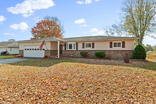 ranch-style home featuring a garage