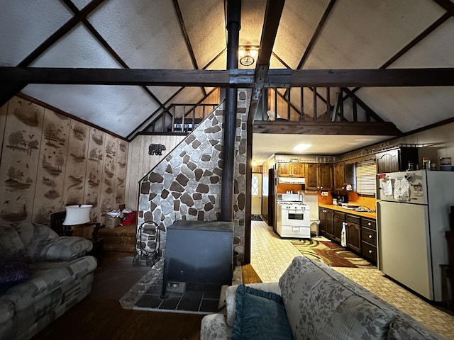 living room with lofted ceiling with beams