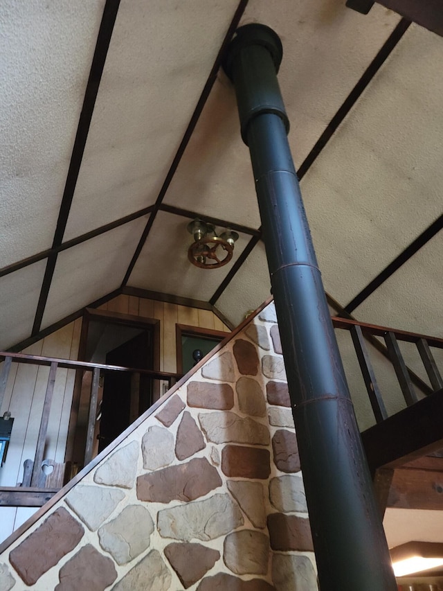 stairs featuring lofted ceiling