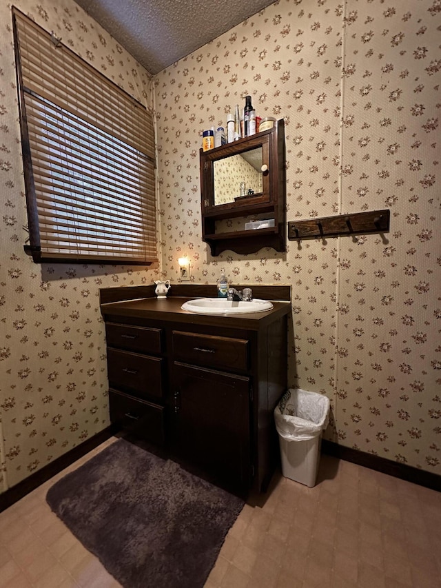 bathroom featuring vanity and a textured ceiling