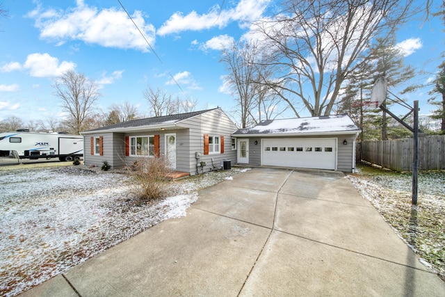 ranch-style home featuring a garage