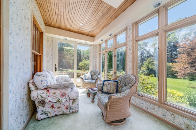 sunroom / solarium featuring plenty of natural light and wood ceiling