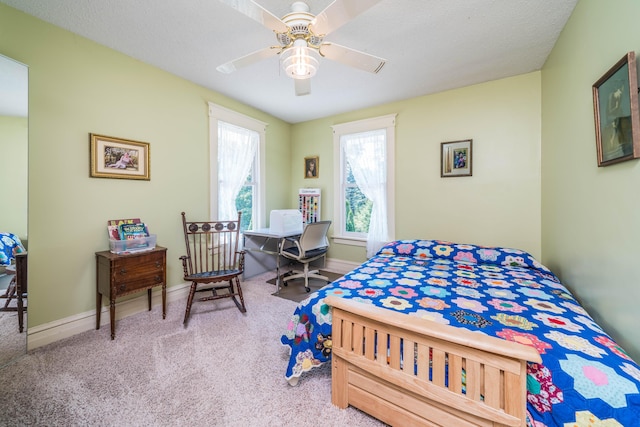 bedroom with ceiling fan and carpet