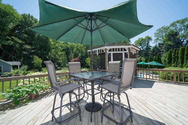 deck with a sunroom