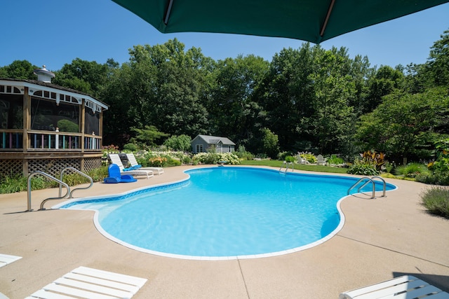 view of swimming pool featuring a gazebo and a patio