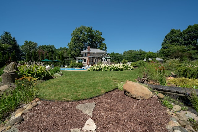 view of yard featuring a pool side deck