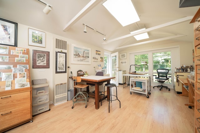 office area featuring rail lighting, light hardwood / wood-style flooring, and vaulted ceiling