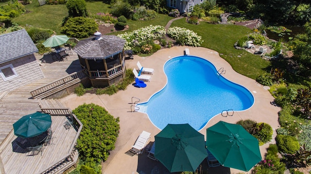 view of swimming pool featuring a gazebo and a deck