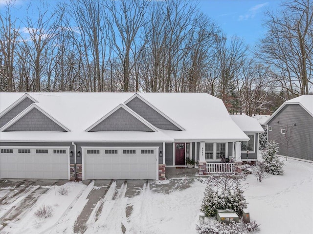 view of front of property featuring a garage and covered porch