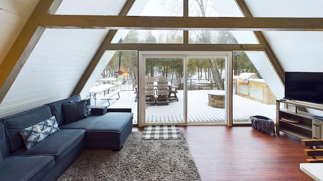 living room featuring beam ceiling, dark wood-type flooring, and high vaulted ceiling