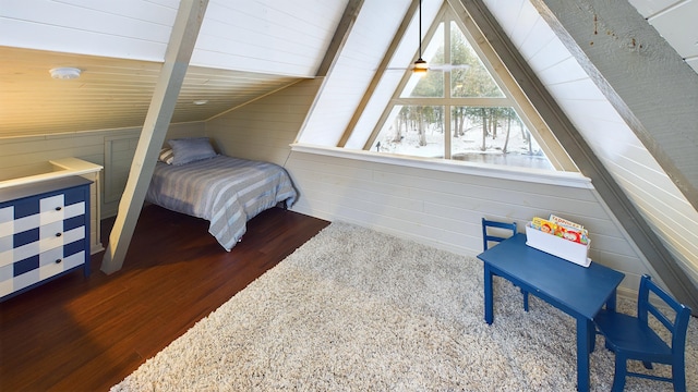 bedroom with dark hardwood / wood-style floors and vaulted ceiling