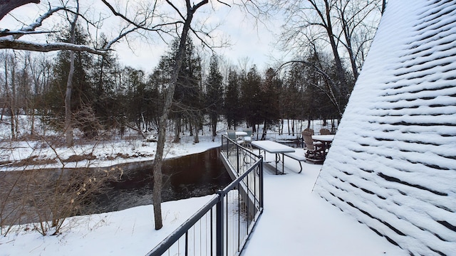 view of yard layered in snow