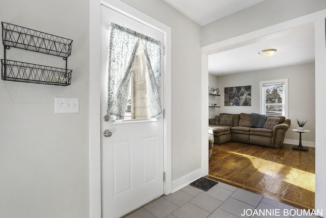 entryway with light tile patterned floors