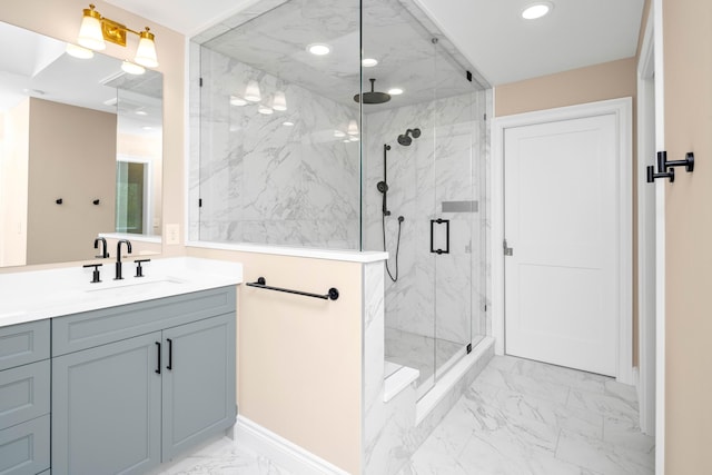 bathroom featuring vanity and an enclosed shower