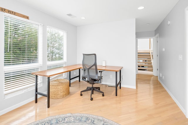 office space with light hardwood / wood-style floors