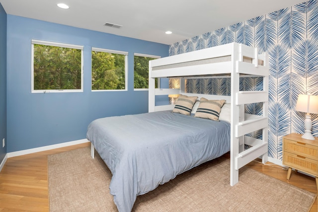 bedroom with light hardwood / wood-style flooring