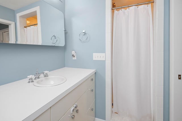 bathroom with vanity and curtained shower